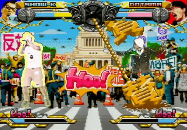 映像演出によるバトルの様子、ステージは国会議事堂／画像はニコニコ生放送より