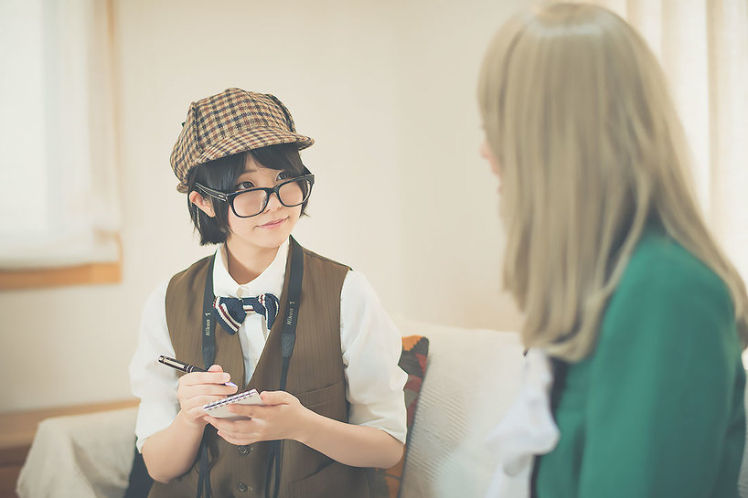 インタビュー内容をメモするくろねこさん